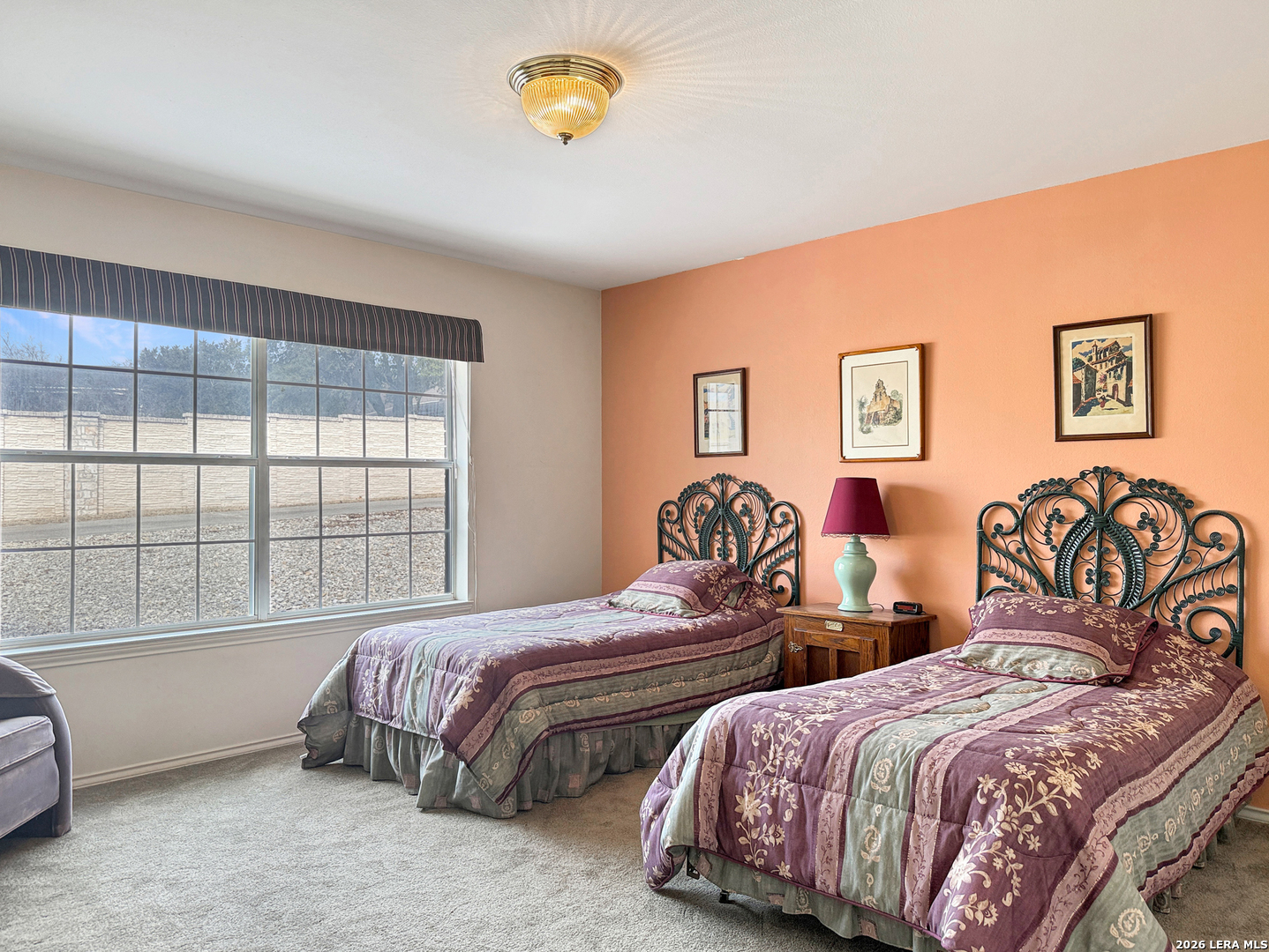 140 St Andrews Loop Kerrville, TX 78028 - Photo 15 of 24 a bedroom with two beds and a window