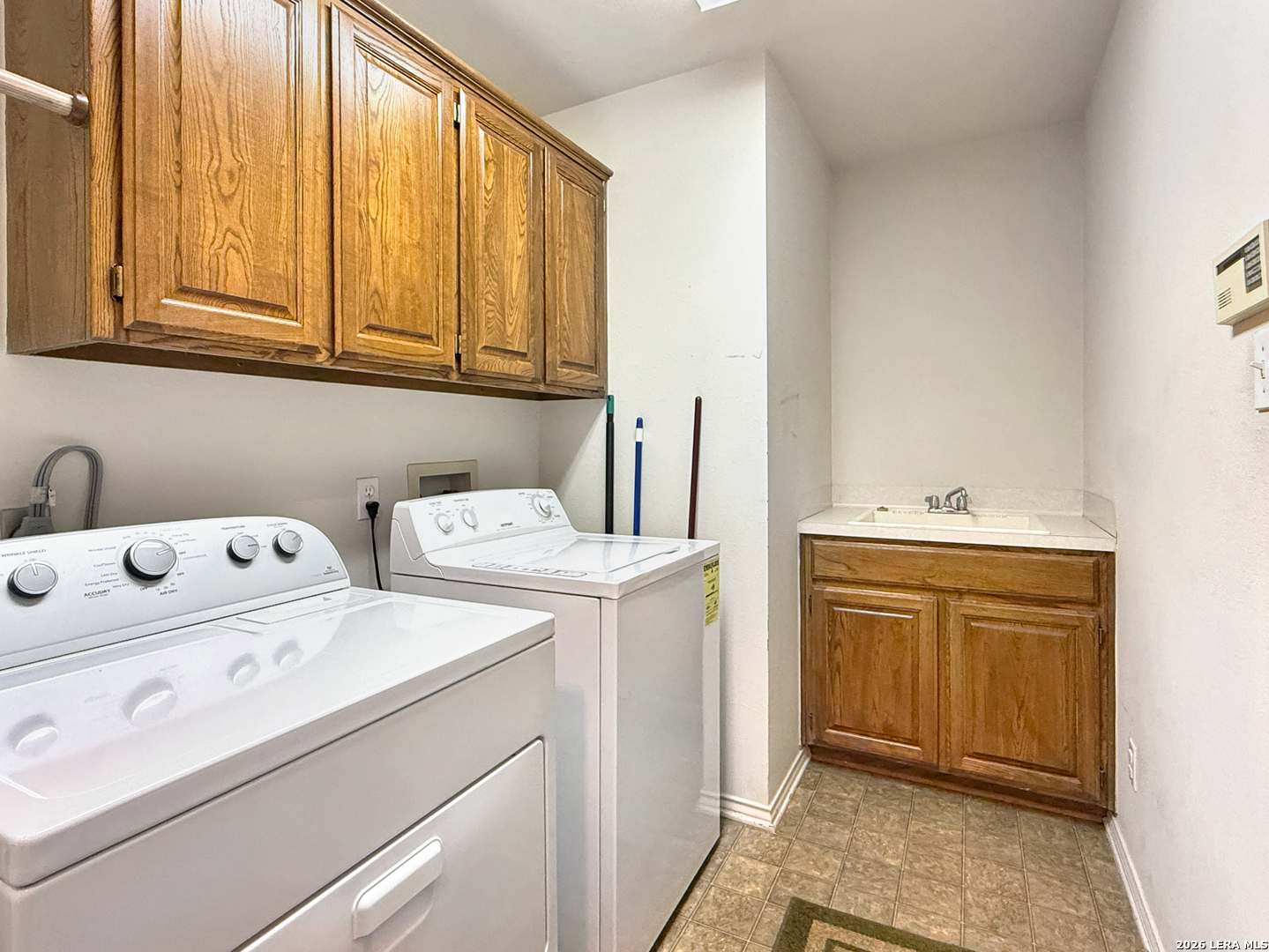 140 St Andrews Loop Kerrville, TX 78028 - Photo 18 of 24 a utility room with dryer and washer