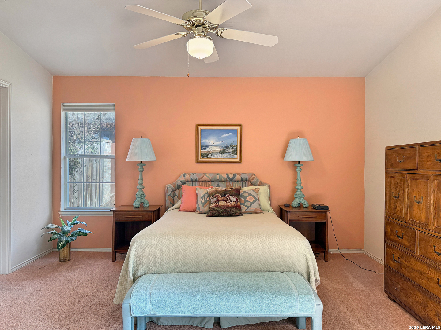 140 St Andrews Loop Kerrville, TX 78028 - Photo 9 of 24 a bedroom with a bed and a chandelier