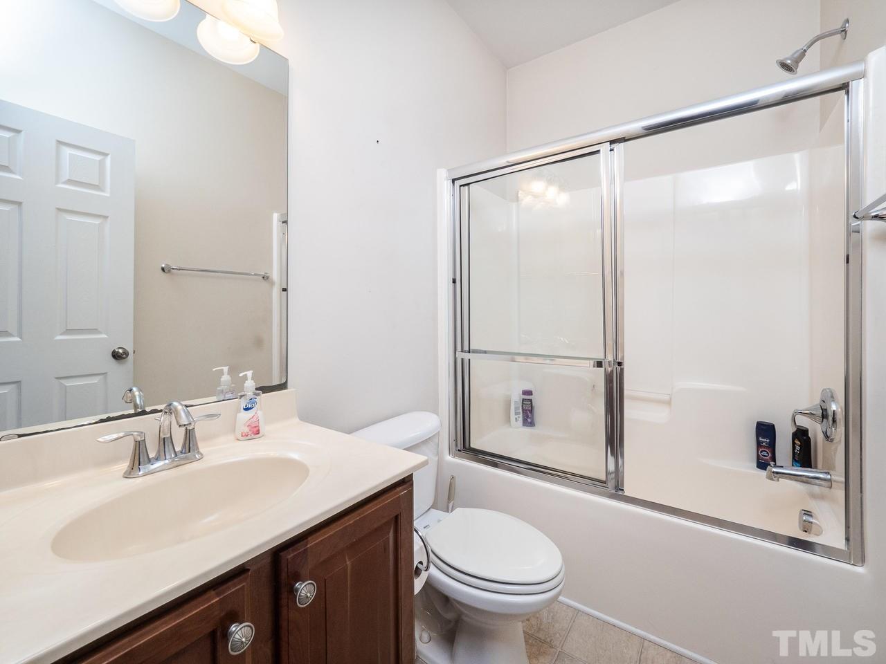 3016 Red Grape Drive Raleigh, NC 27607 - Photo 12 of 23 a bathroom with a sink toilet and shower