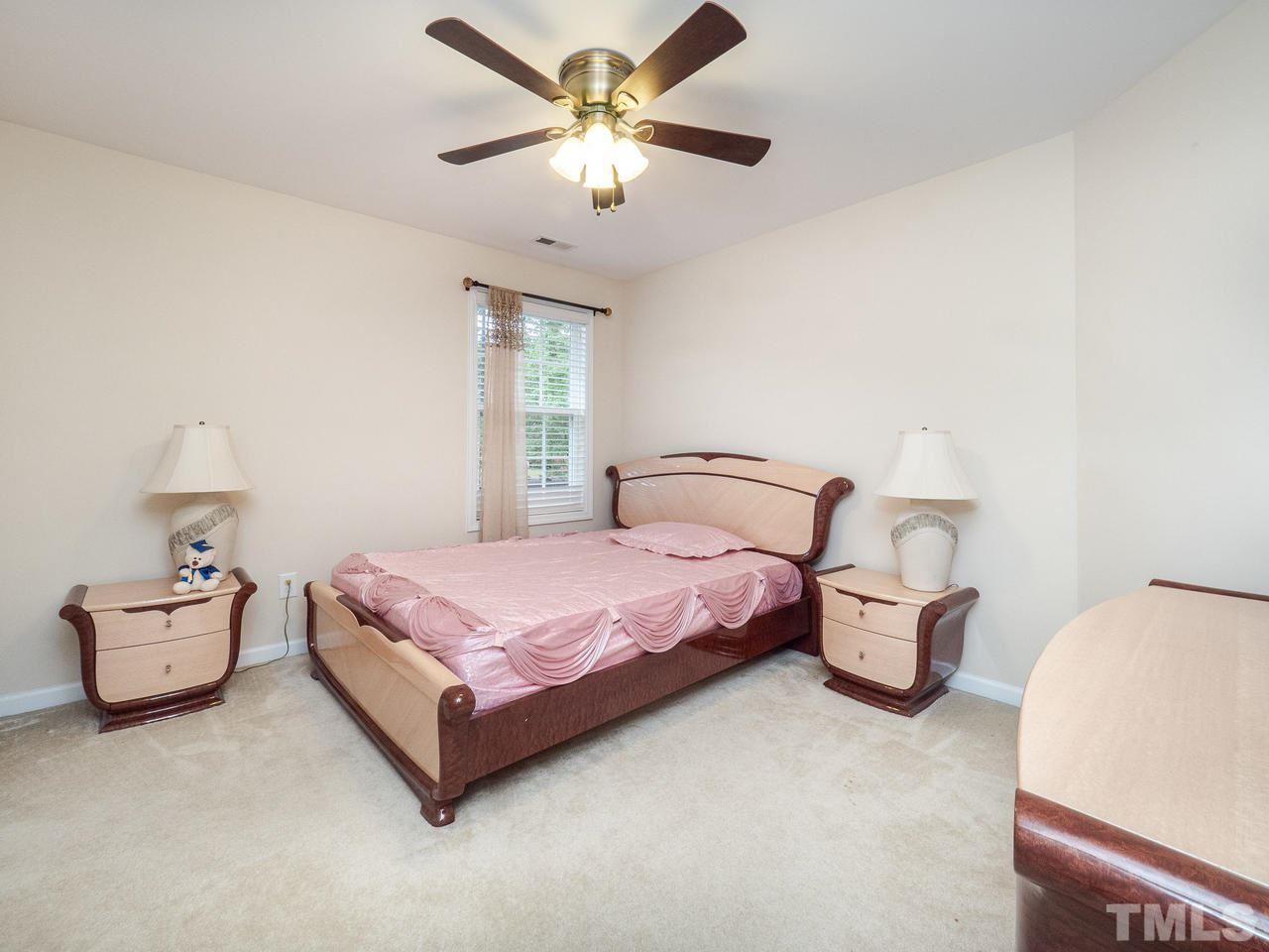 3016 Red Grape Drive Raleigh, NC 27607 - Photo 14 of 23 a bedroom with a bed and window