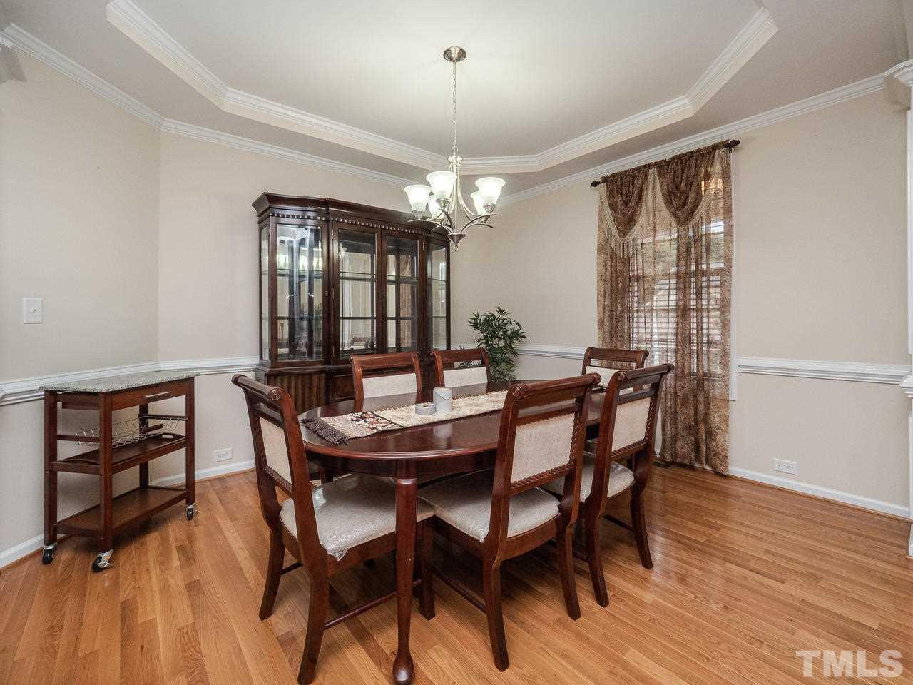 3016 Red Grape Drive Raleigh, NC 27607 - Photo 6 of 23 a view of a dining room with furniture window and wooden floor