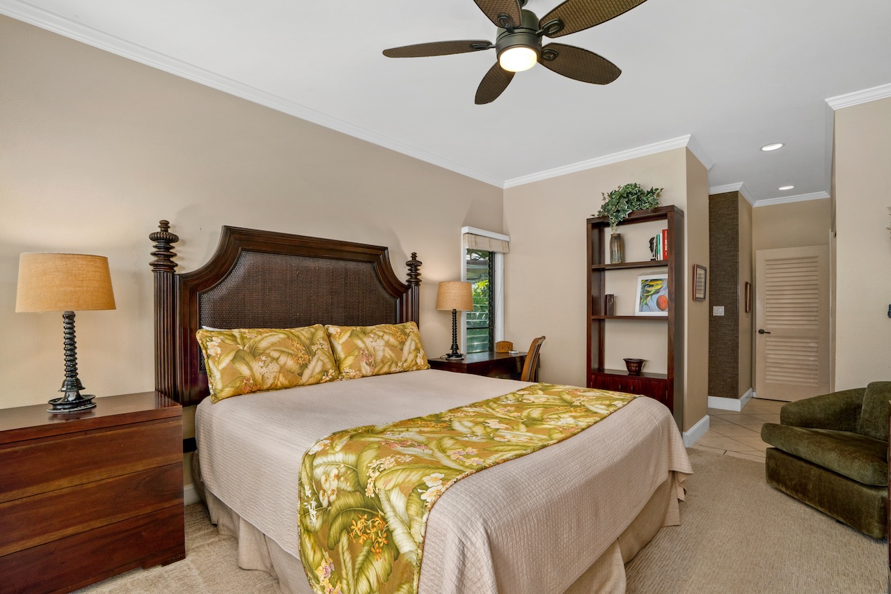 1565 Pe'e Road, Unit 211 Koloa, HI 96756 - Photo 11 of 30 a bedroom with a bed and a lamp