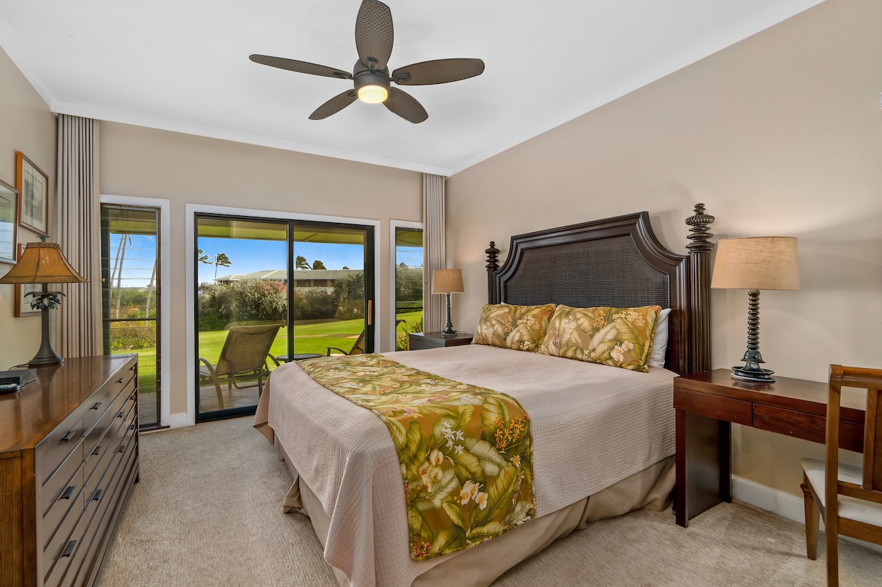 1565 Pe'e Road, Unit 211 Koloa, HI 96756 - Photo 12 of 30 a bedroom with a bed and a large window