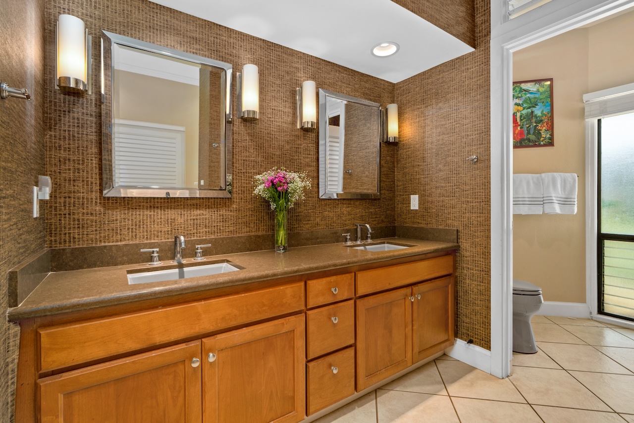 1565 Pe'e Road, Unit 211 Koloa, HI 96756 - Photo 15 of 30 a bathroom with a sink and a mirror