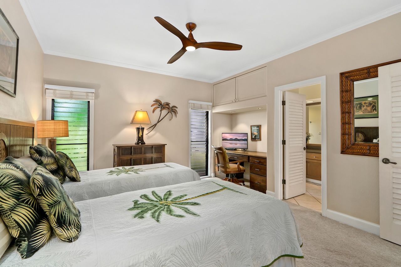 1565 Pe'e Road, Unit 211 Koloa, HI 96756 - Photo 16 of 30 a bedroom with a large bed and a chandelier