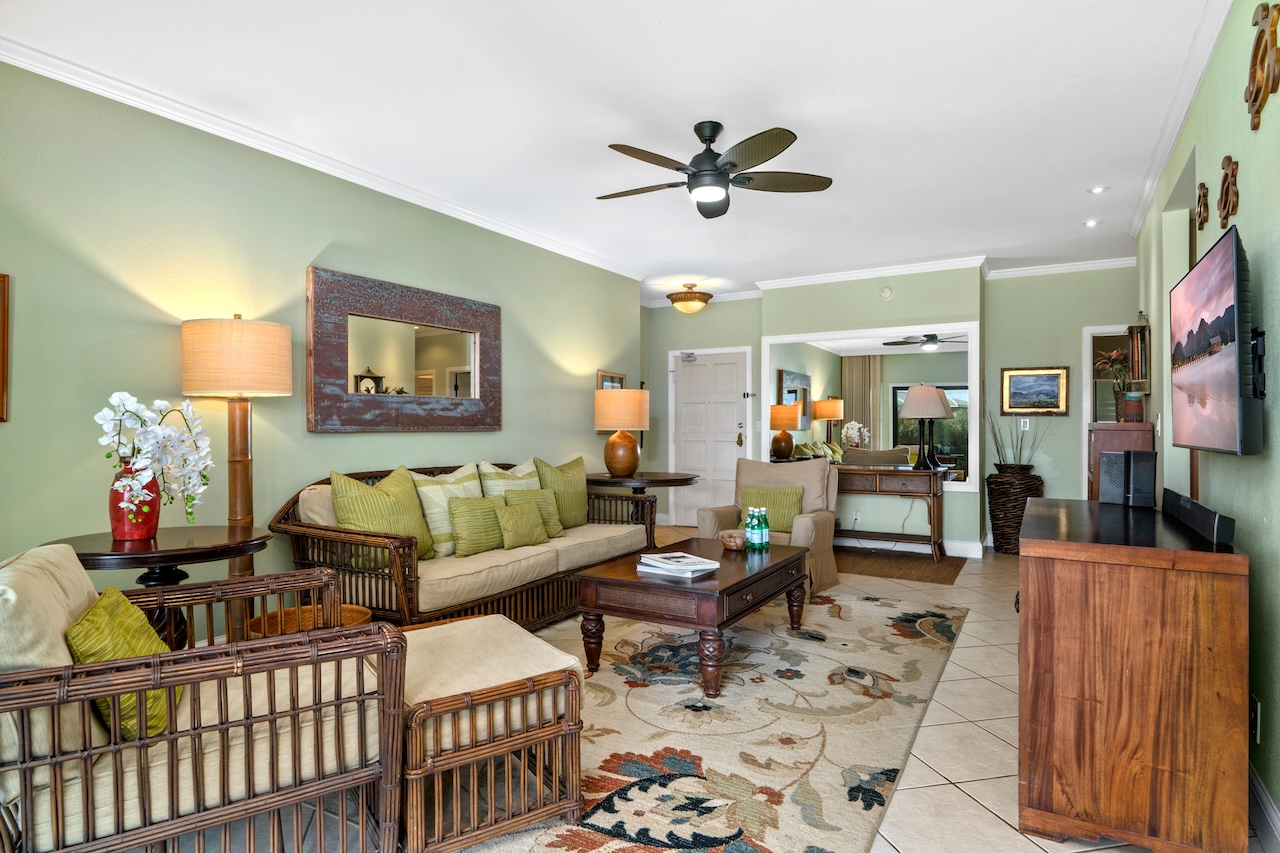 1565 Pe'e Road, Unit 211 Koloa, HI 96756 - Photo 2 of 30 a living room with furniture and a flat screen tv