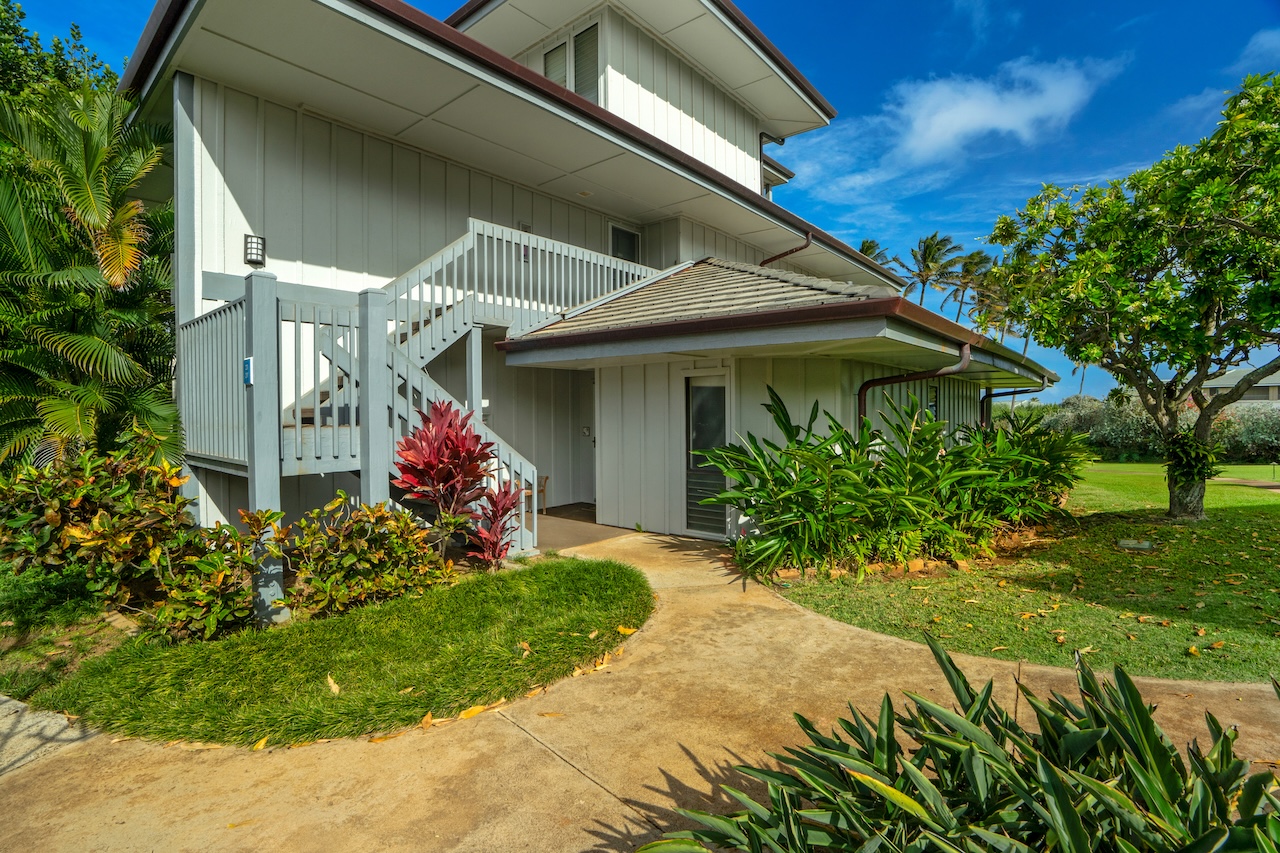 1565 Pe'e Road, Unit 211 Koloa, HI 96756 - Photo 21 of 30 a front view of a house with a porch