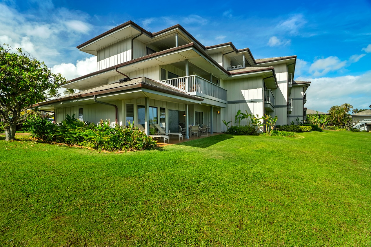 1565 Pe'e Road, Unit 211 Koloa, HI 96756 - Photo 29 of 30 a front view of a house with garden