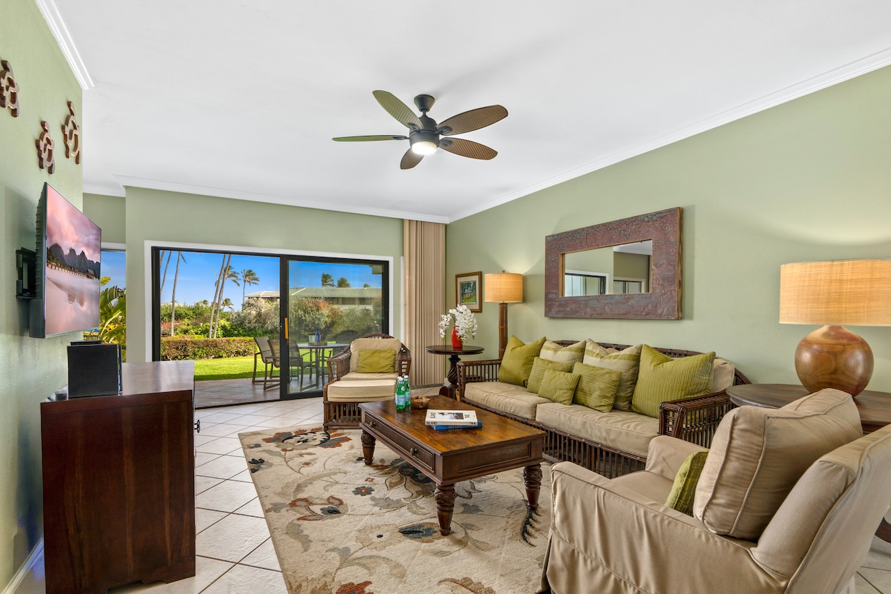 1565 Pe'e Road, Unit 211 Koloa, HI 96756 - Photo 3 of 30 a living room with furniture and a large window