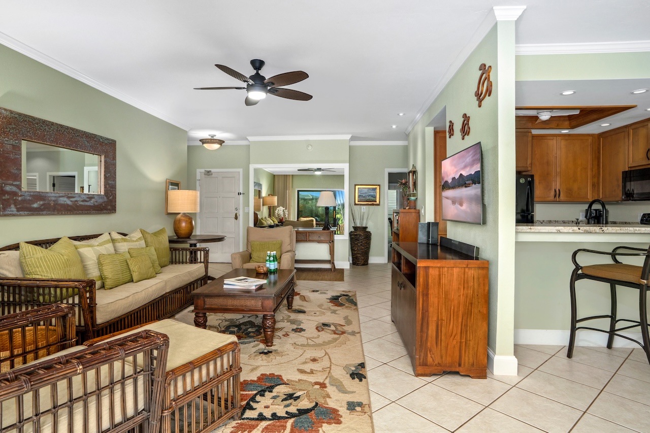 1565 Pe'e Road, Unit 211 Koloa, HI 96756 - Photo 5 of 30 a living room with furniture and a window