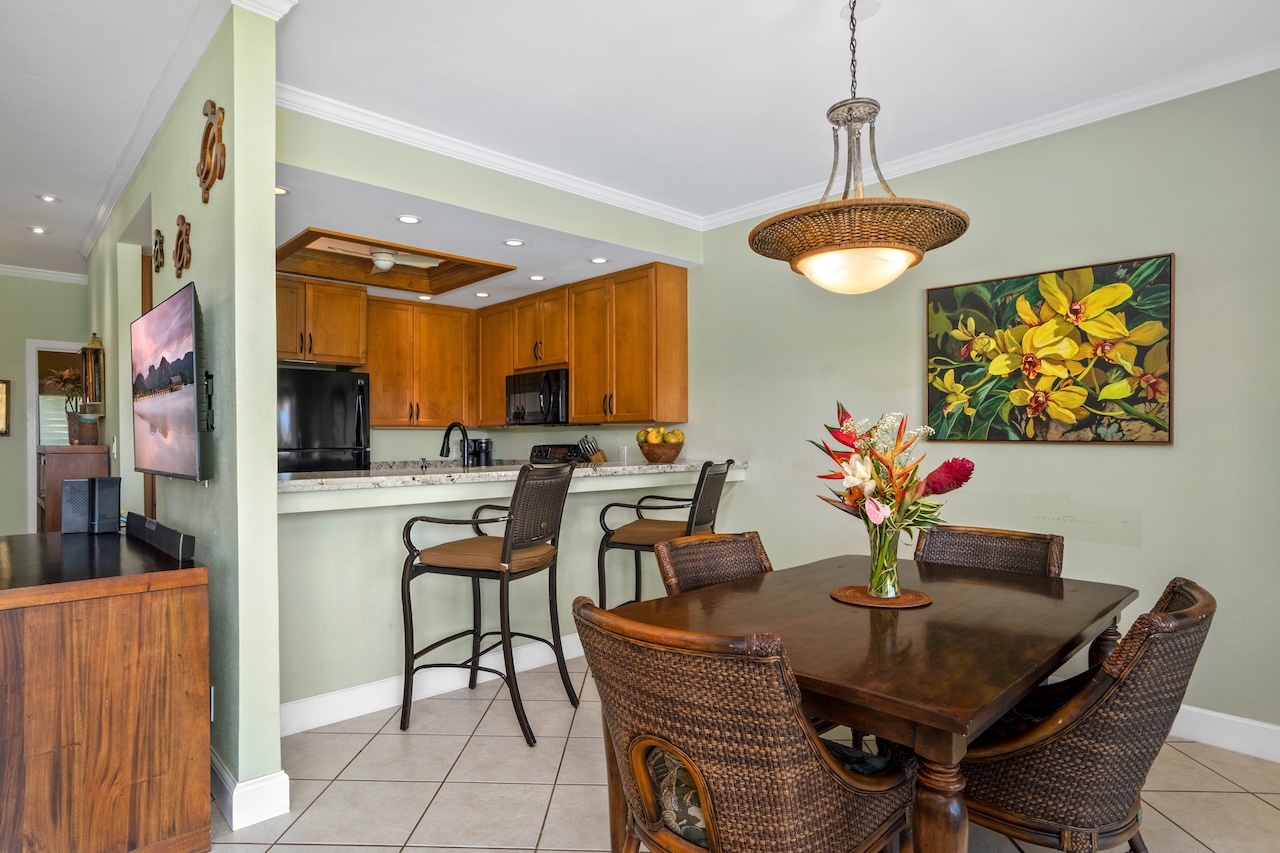 1565 Pe'e Road, Unit 211 Koloa, HI 96756 - Photo 9 of 30 a view of a dining room with furniture