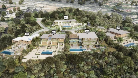 an aerial view of a residential apartment building with a yard