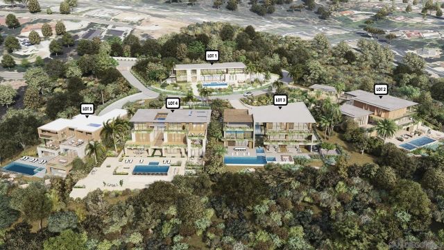 an aerial view of a residential apartment building with a yard