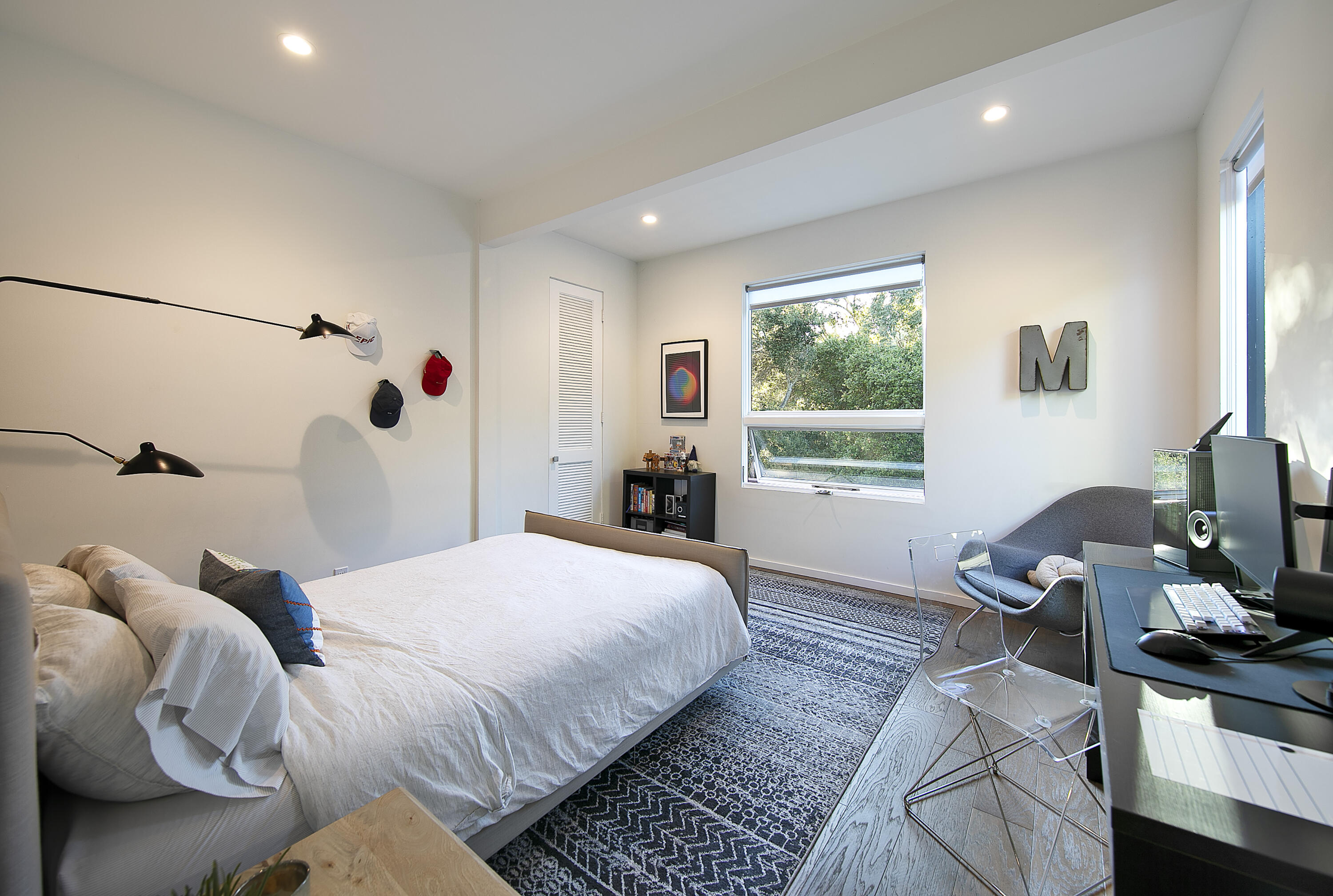 975 Mariposa Lane Montecito, CA 93108 - Photo 13 of 19 a bedroom with a bed and wooden floor
