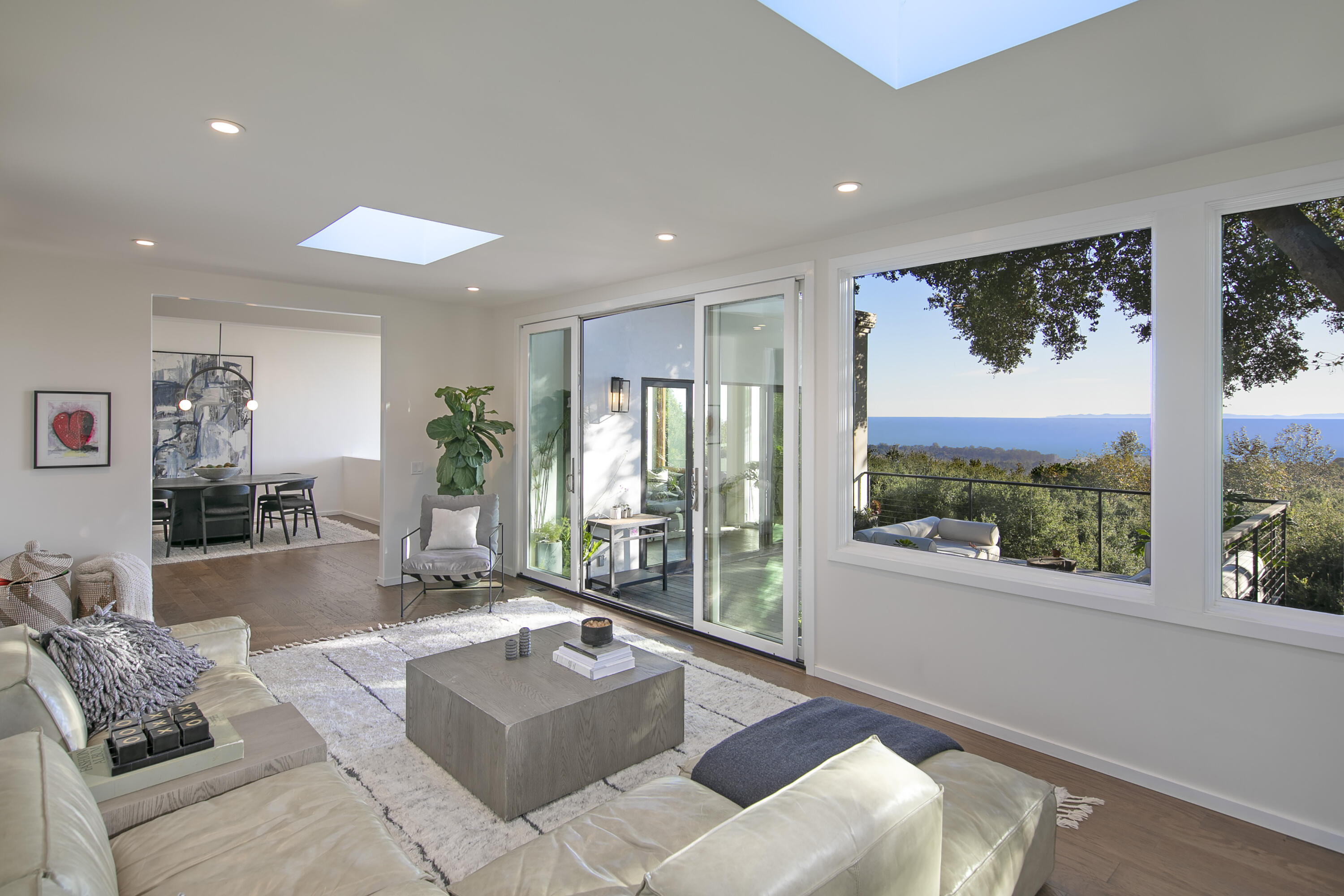 975 Mariposa Lane Montecito, CA 93108 - Photo 8 of 19 a living room with furniture and large windows