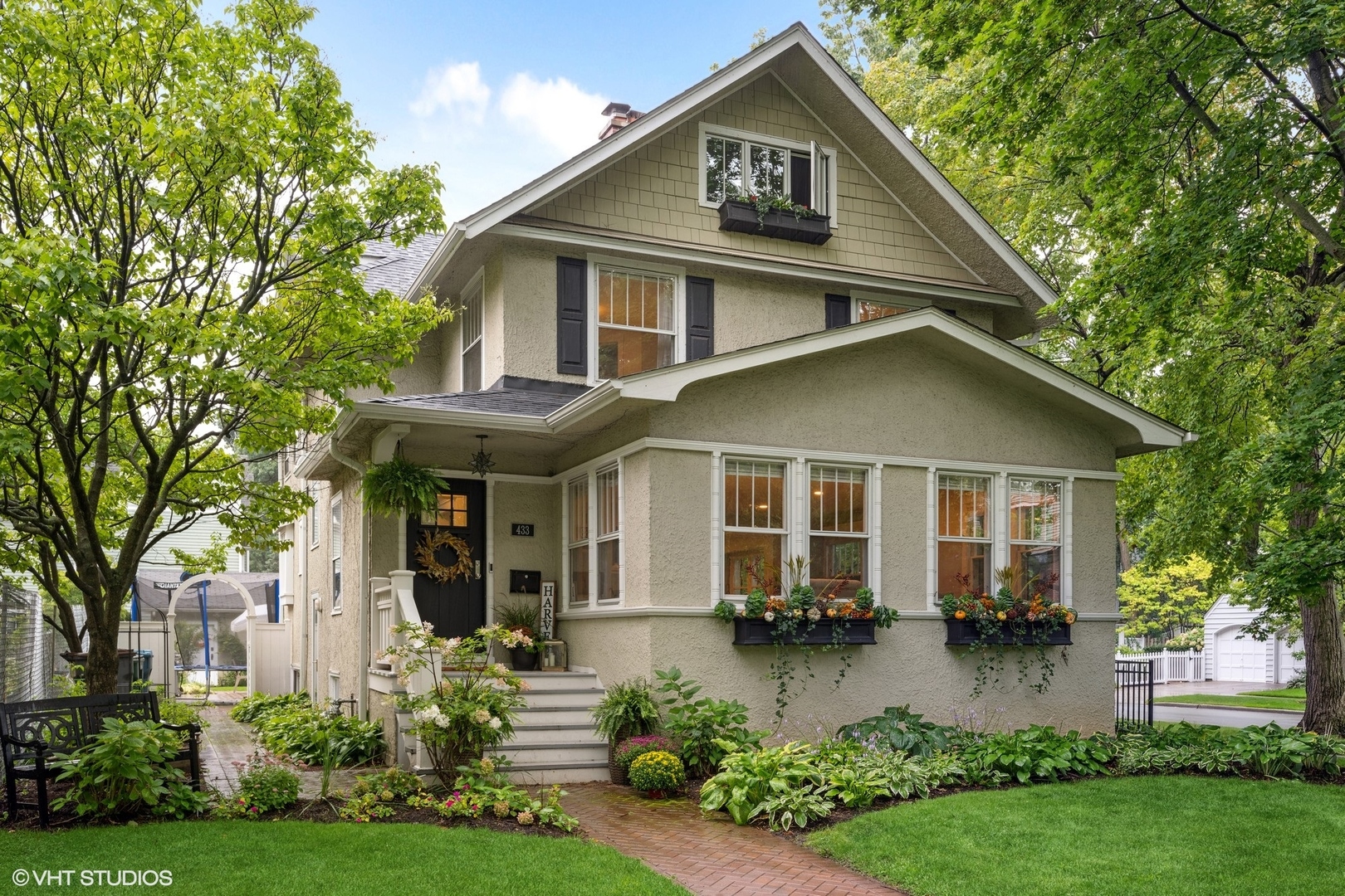 a front view of a house with a yard and porch