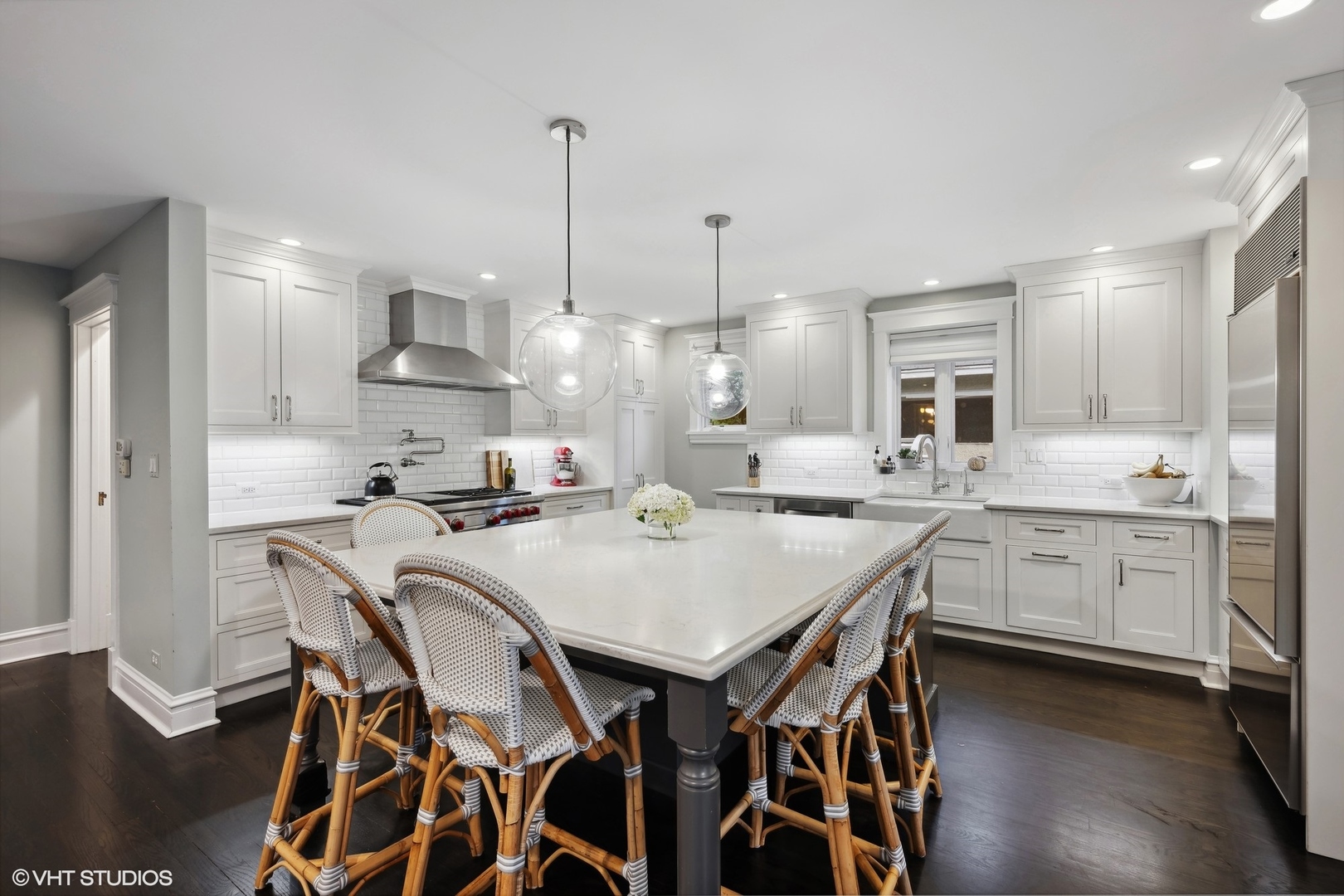 433 Maple Avenue Wilmette, IL 60091 - Photo 5 of 34 a kitchen with a table chairs sink and cabinets