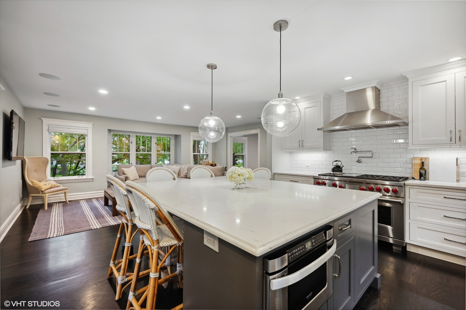 433 Maple Avenue Wilmette, IL 60091 - Photo 7 of 34 a large kitchen with stainless steel appliances granite countertop a stove and a view of dining hall with couches