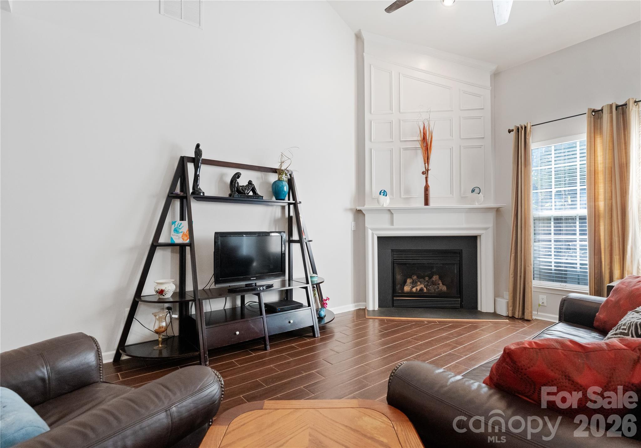 20127 Beard Street Cornelius, NC 28031 - Photo 11 of 41 a living room with furniture and a fireplace