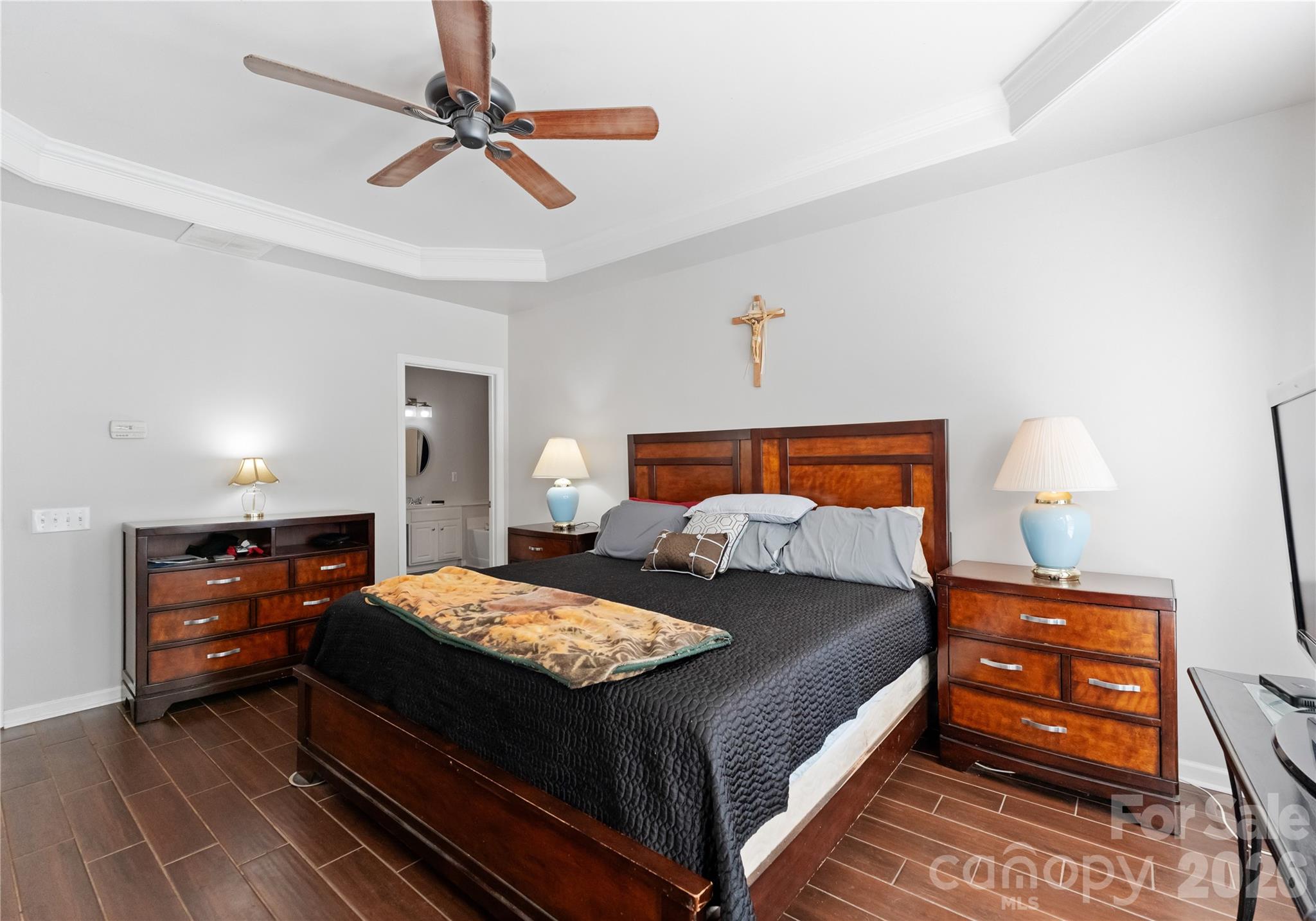 20127 Beard Street Cornelius, NC 28031 - Photo 15 of 41 a bedroom with a bed and a chandelier