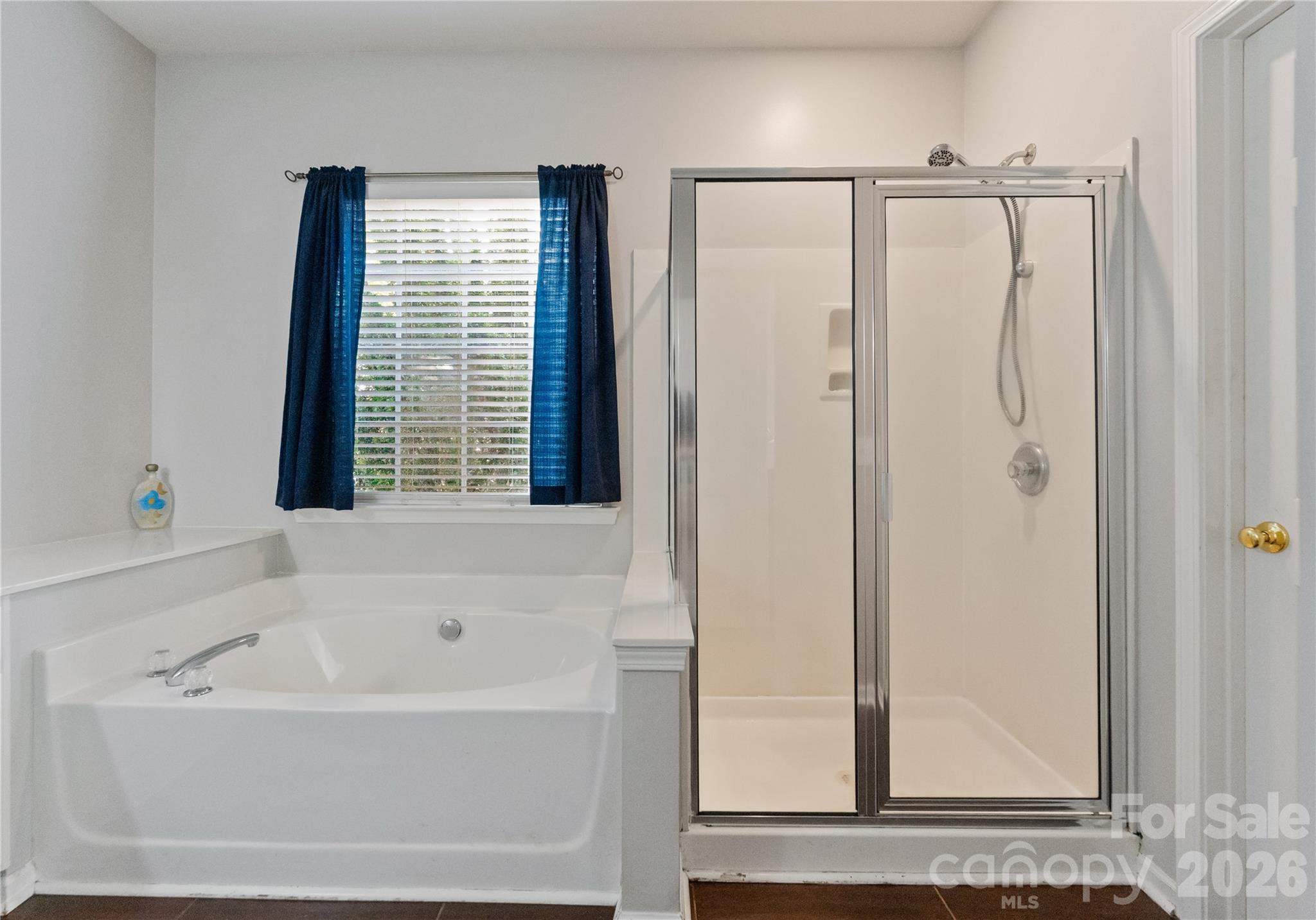 20127 Beard Street Cornelius, NC 28031 - Photo 17 of 41 a bathroom with a bathtub and a shower