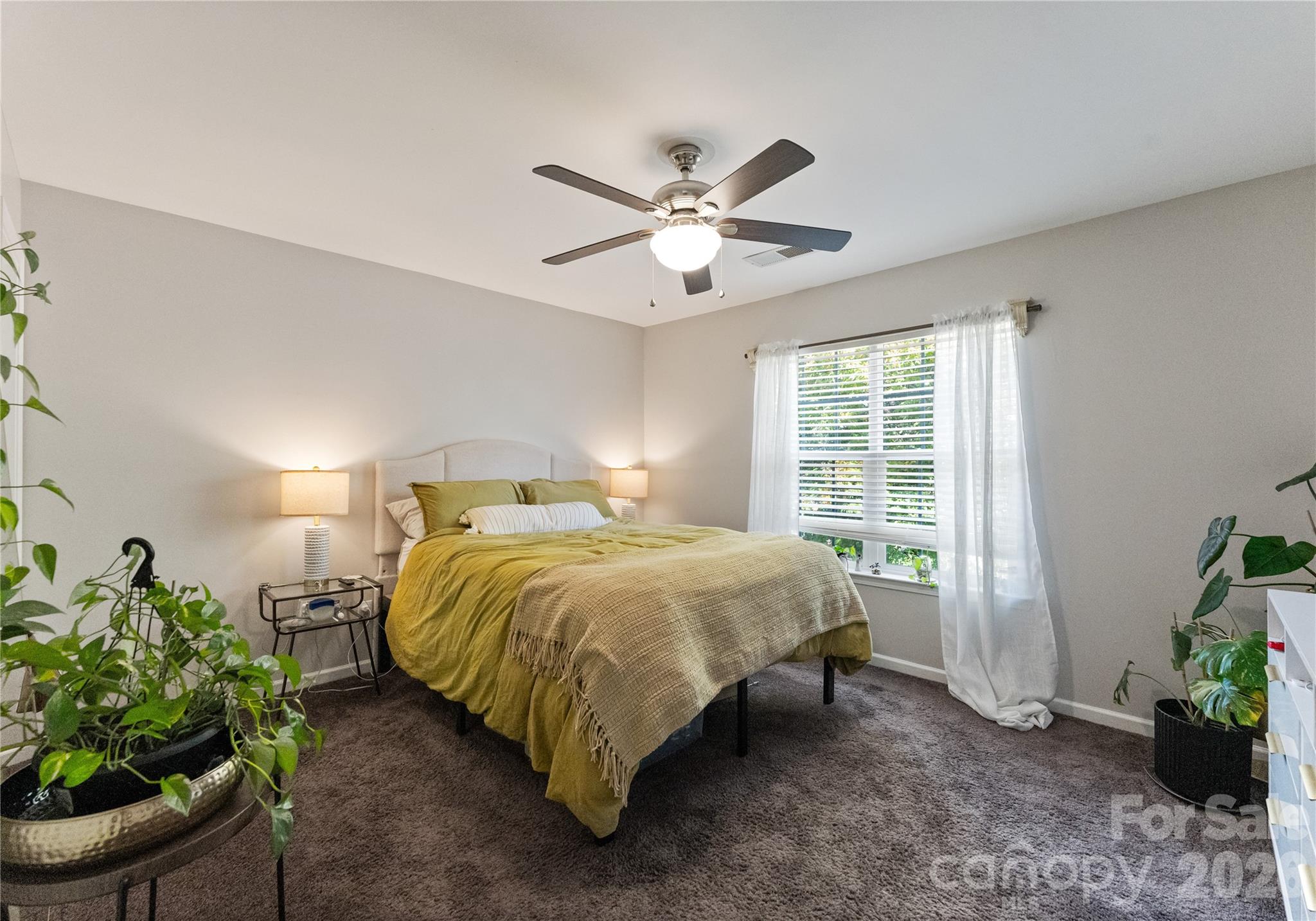 20127 Beard Street Cornelius, NC 28031 - Photo 19 of 41 a bed sitting in a spacious bedroom next to a window