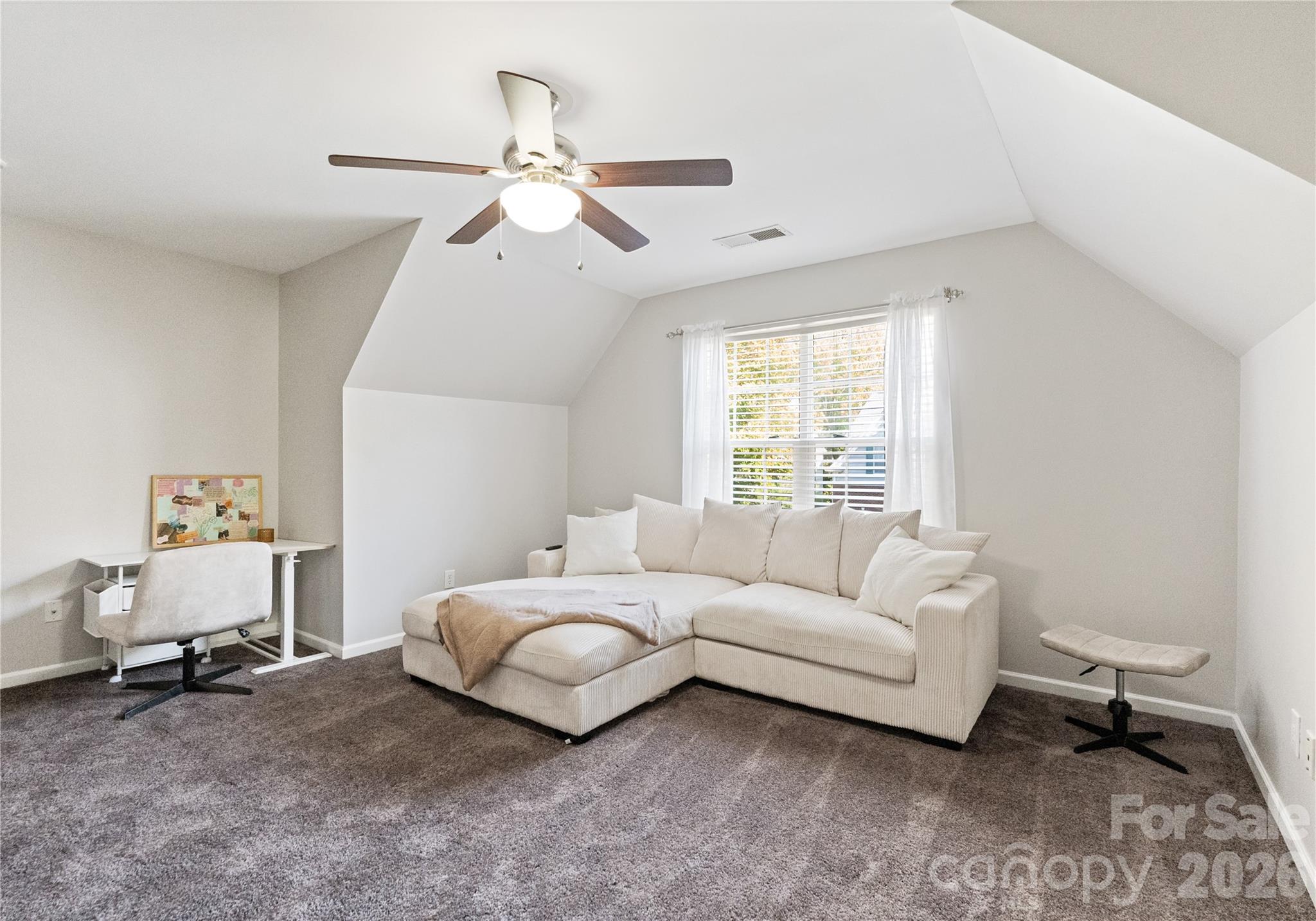 20127 Beard Street Cornelius, NC 28031 - Photo 22 of 41 a living room with a bed furniture and a window