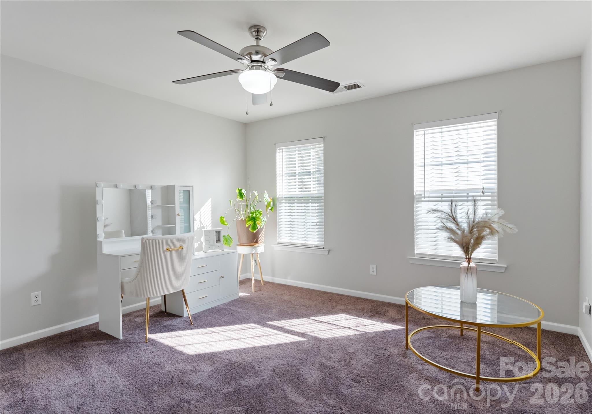 20127 Beard Street Cornelius, NC 28031 - Photo 25 of 41 a living room with furniture and a chandelier