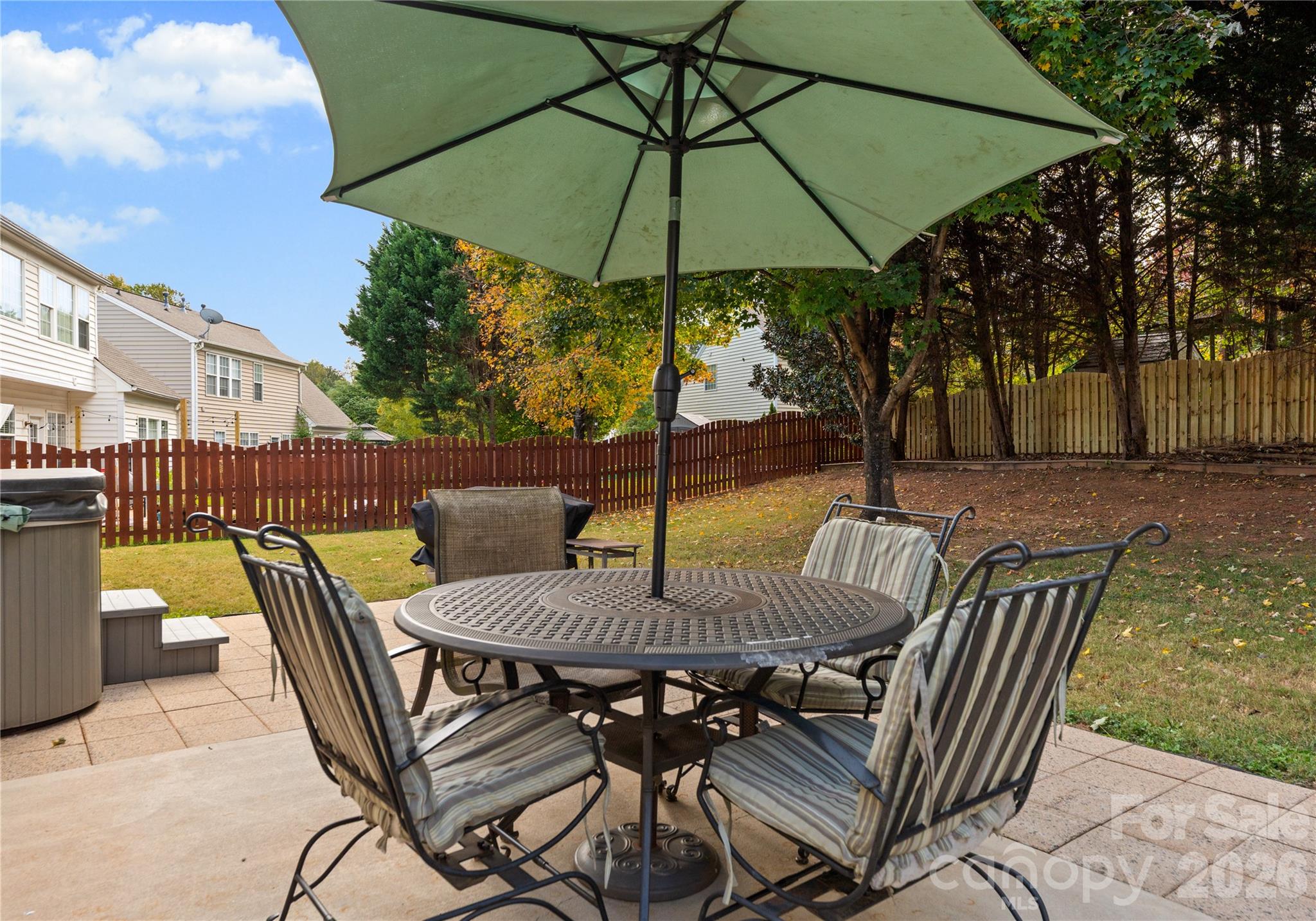 20127 Beard Street Cornelius, NC 28031 - Photo 27 of 41 a view of an outdoor sitting area with furniture and umbrella