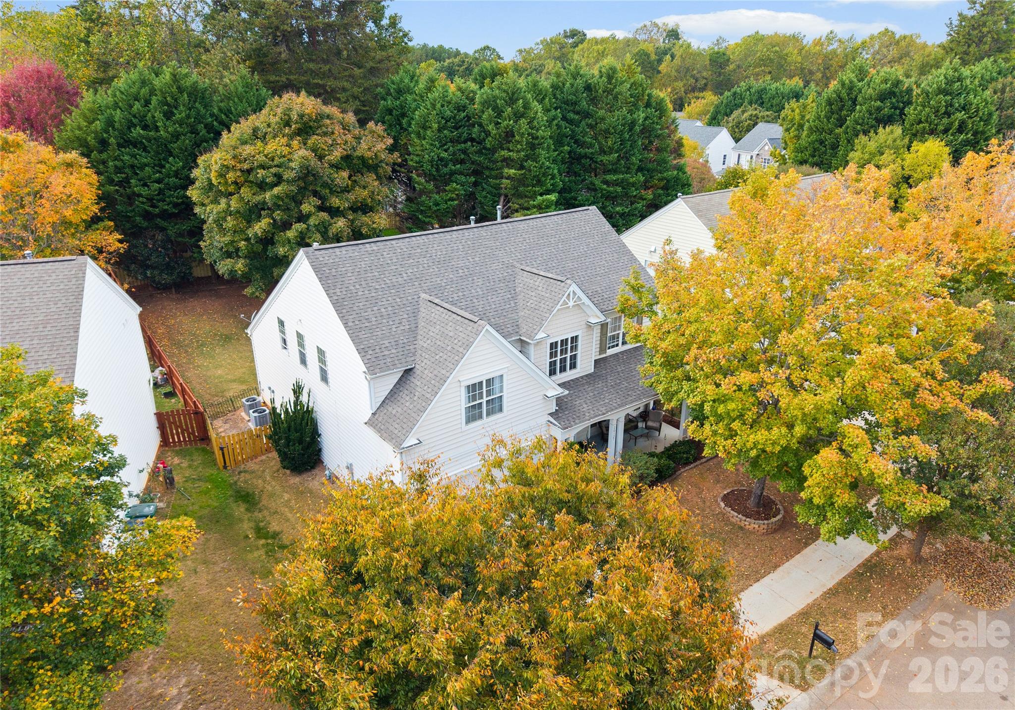 20127 Beard Street Cornelius, NC 28031 - Photo 32 of 41 an aerial view of a house with a yard and garden