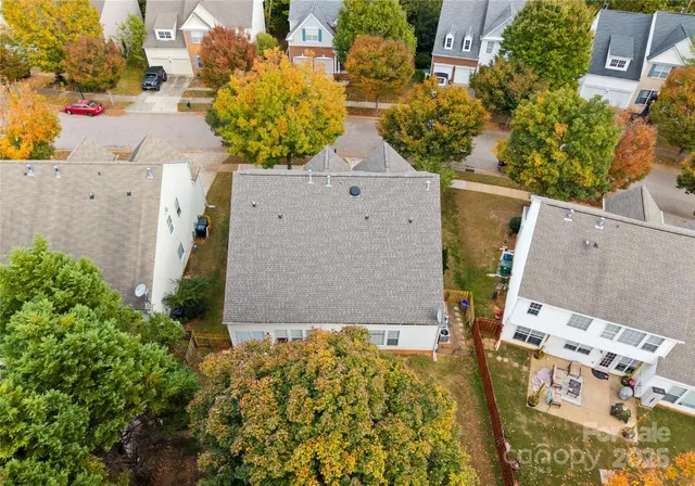 an aerial view of residential houses with outdoor space