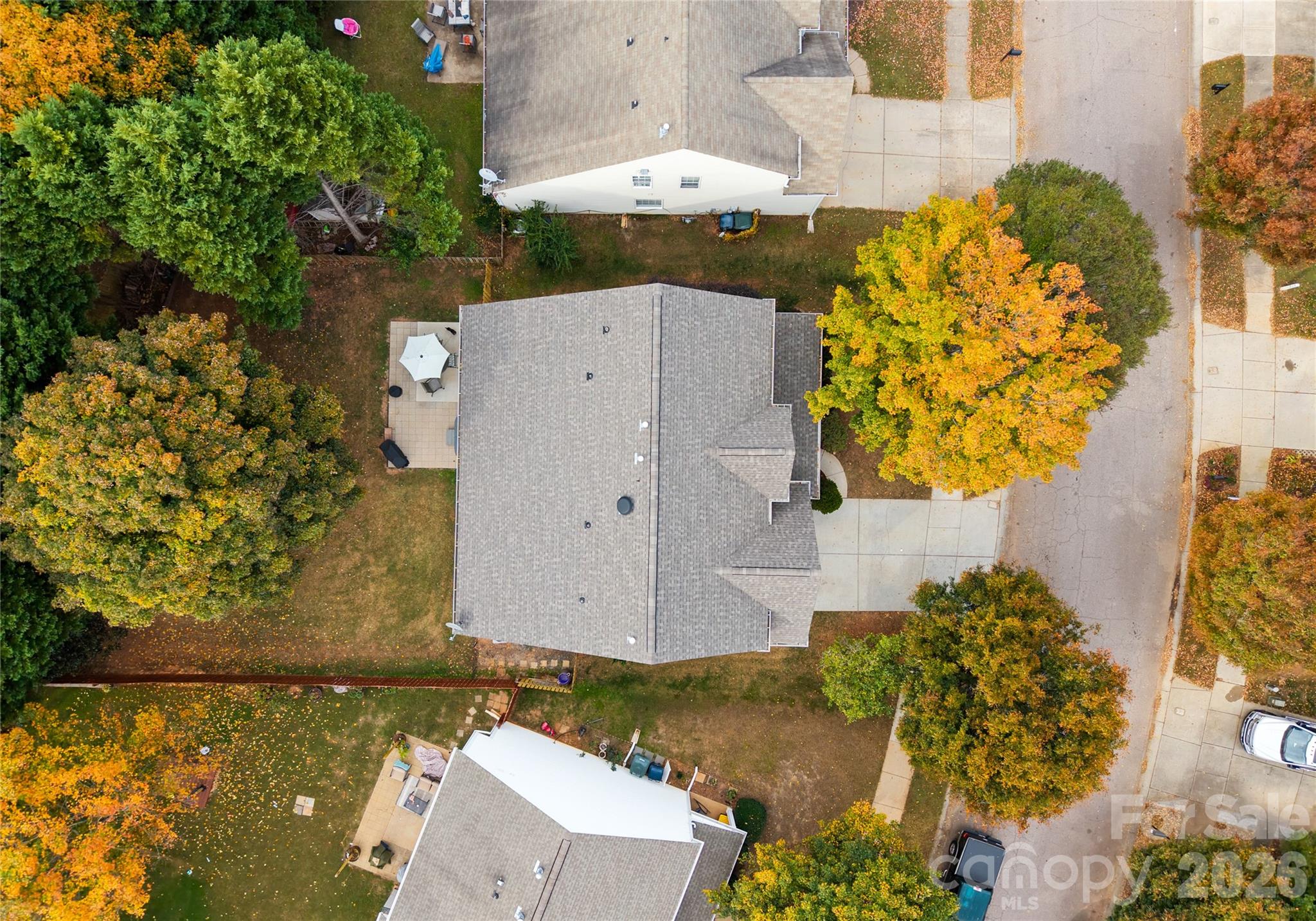 20127 Beard Street Cornelius, NC 28031 - Photo 36 of 41 an aerial view of a house with a yard and garden