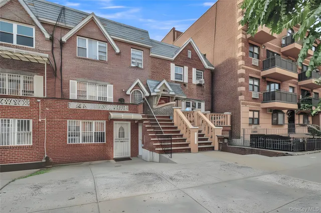 a view of a building with a yard