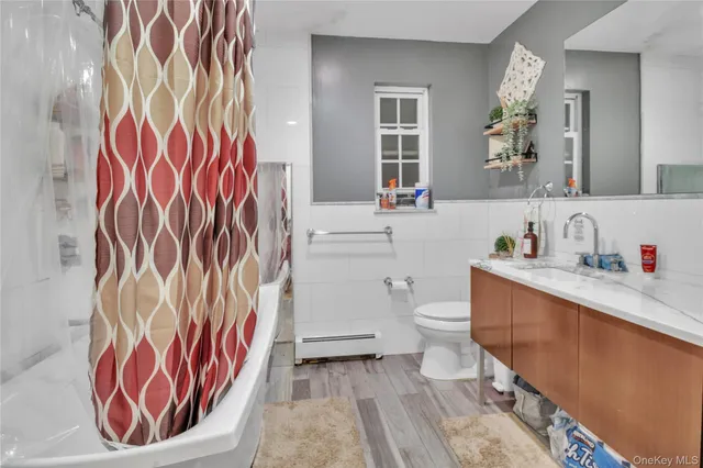 a bedroom with a bed and cabinets