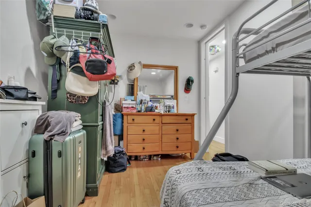 a bed room with furniture and a flat screen tv