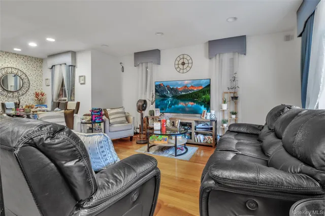 a kitchen with stainless steel appliances granite countertop a refrigerator a stove a sink and a microwave