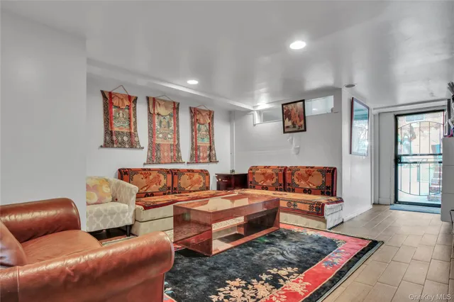 a living room with furniture and a rug