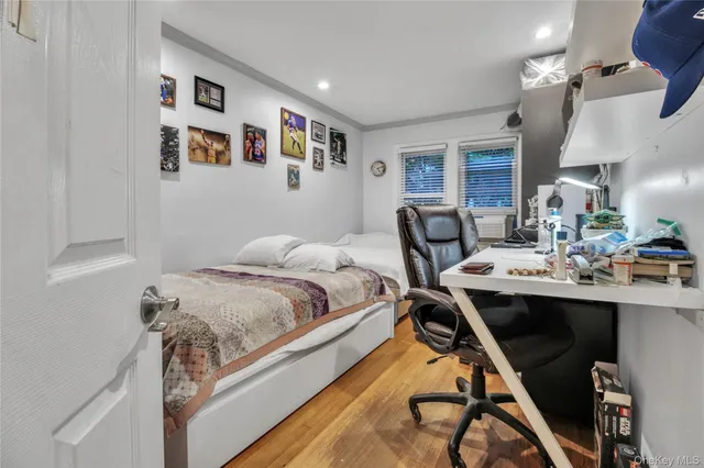 a bedroom with bed and a window