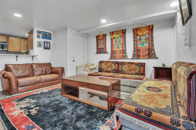 a living room with furniture rug and window
