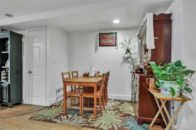 a view of a livingroom with furniture and a potted plant