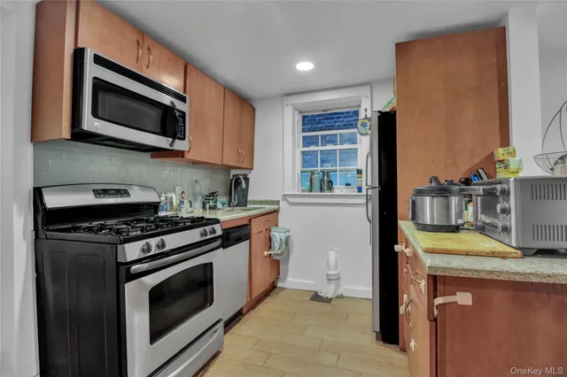 a kitchen with a stove and a microwave