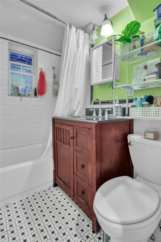 a bathroom with a toilet a sink and a bathtub