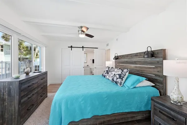 a bedroom with a bed and a dresser