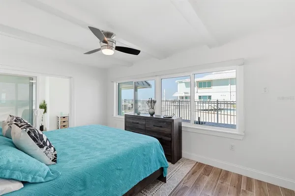 a bedroom with a large bed and a window