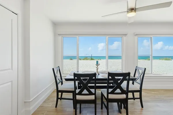 a view of a dining room with furniture and window