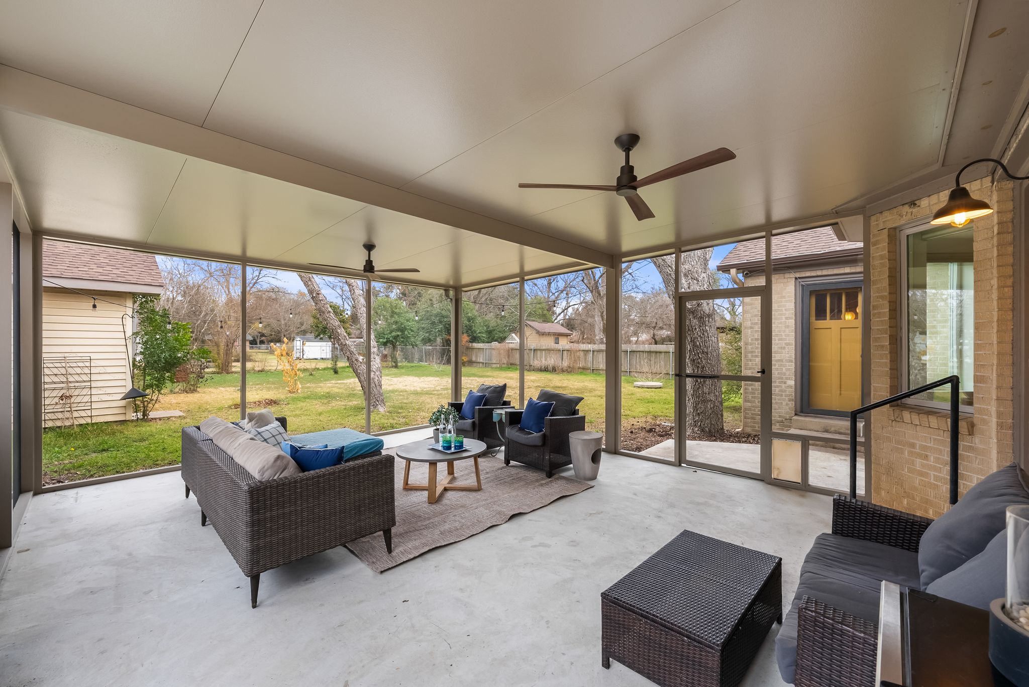 1612 Meadow Lane Taylor, TX 76574 - Photo 11 of 35 Fully screened sunroom featuring multiple areas large enough for a living room setup and outdoor dining. Two fans to keep you cool on hot summers.