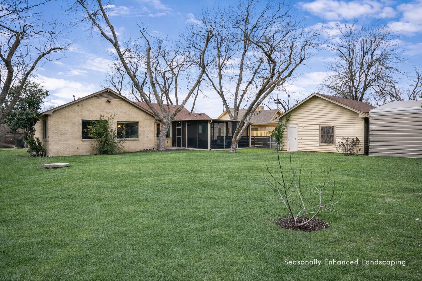 1612 Meadow Lane Taylor, TX 76574 - Photo 28 of 35 Off the driveway is a 2 car carport that leads to a 2 car garage with workshop. A garage door allows you to drive all the way through the garage to the rear aluminum covered storage area where additional cars or riding mower can be stored!
