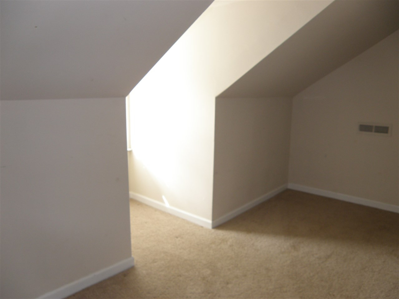 1801 Banbury Road Raleigh, NC 27608 - Photo 23 of 25 I call this a nook due to the low ceiling height, this little room wraps around behind the stairwell box to create more nook space. NOOK