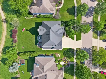an aerial view of a house with a garden